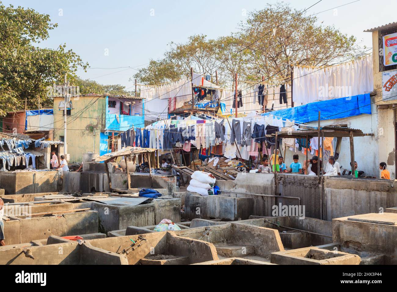 View of concrete wash pens and drying clothes at Mahalaxmi Dhobi Ghat, a large open air laundromat in Mumbai, India Stock Photo