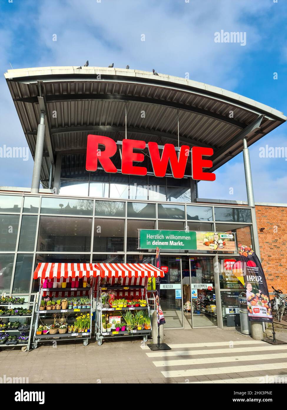 Entrance of a REWE supermarket in Germany in sunny weather Stock Photo Alamy