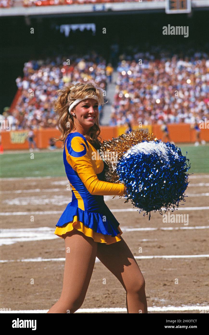 United States. Sport. Young woman cheerleader at American Football came. Stock Photo