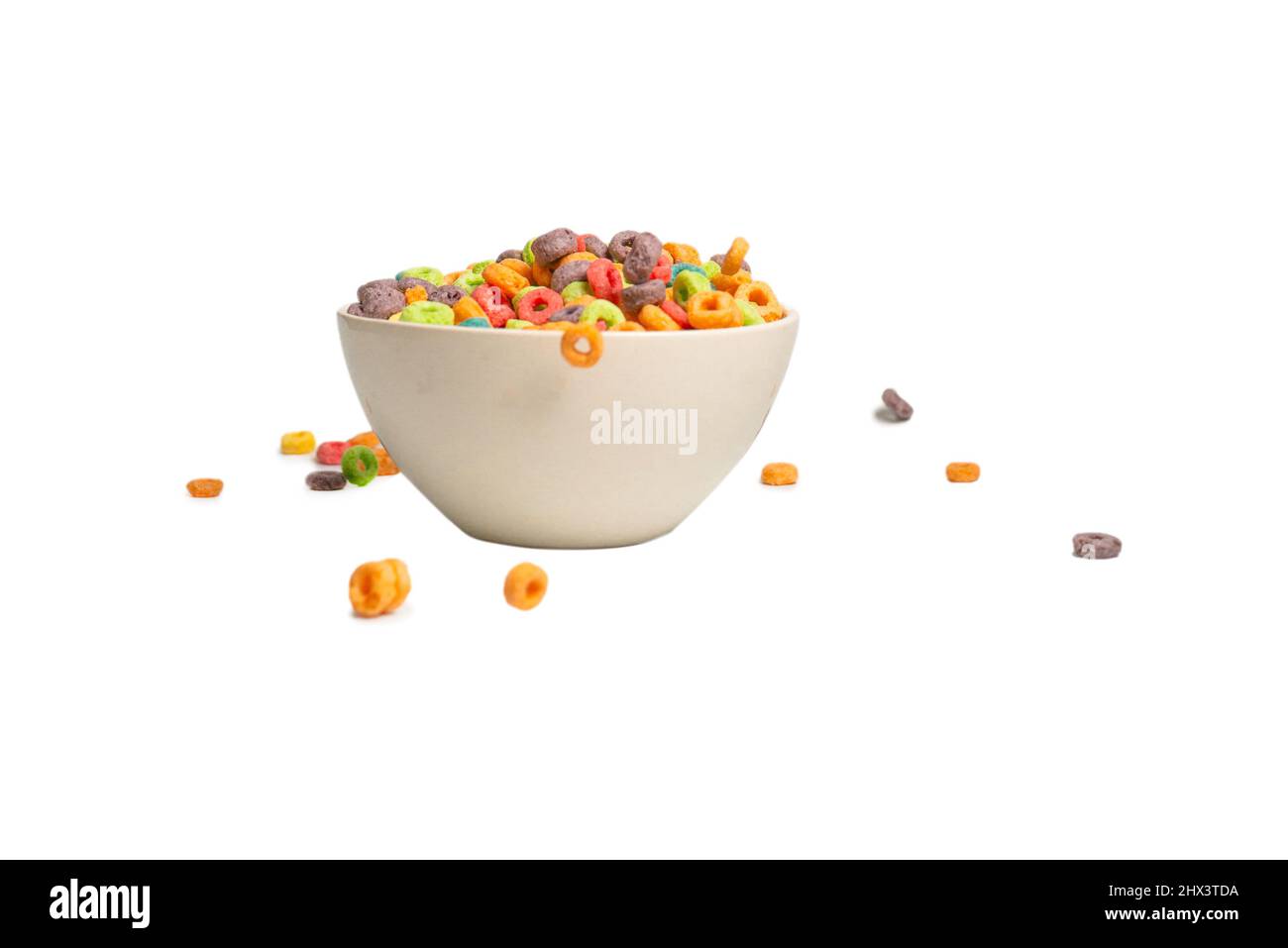 Colorful cereal box for morning breakfast. Corn flakes falling to the