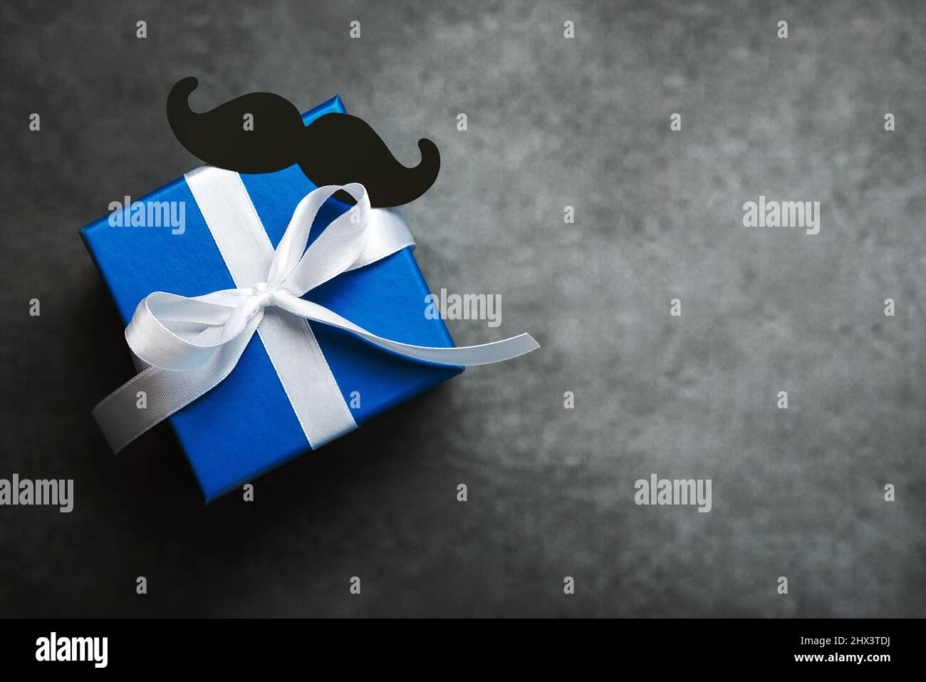 Happy Father´s Day. Top view of gifts box,false mustache with copy space. Father´s Day celebration concept Stock Photo