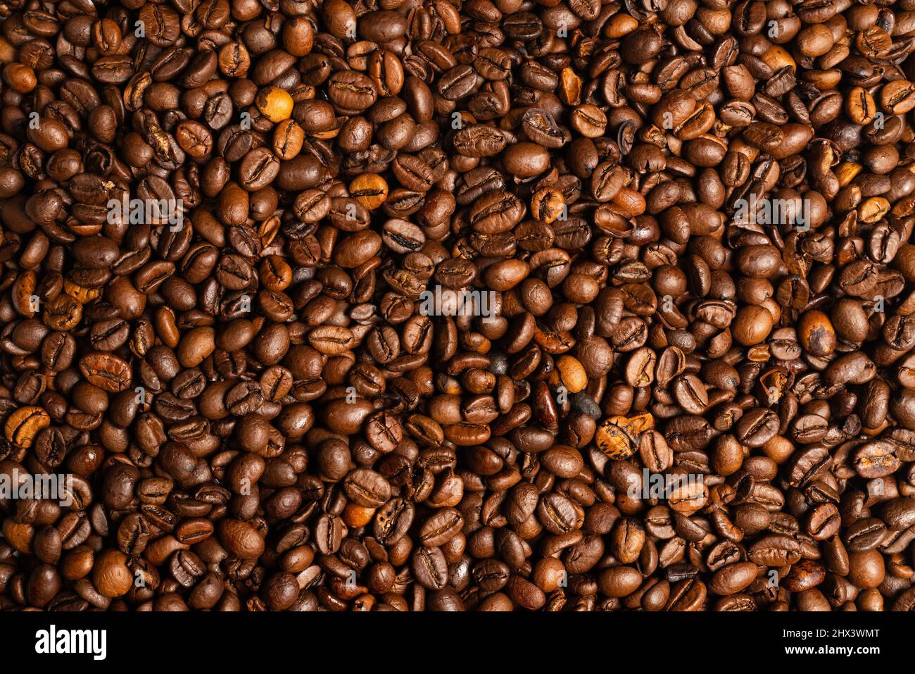 Coffee beans on a white background. Top view. Coffee beans texture. Stock Photo