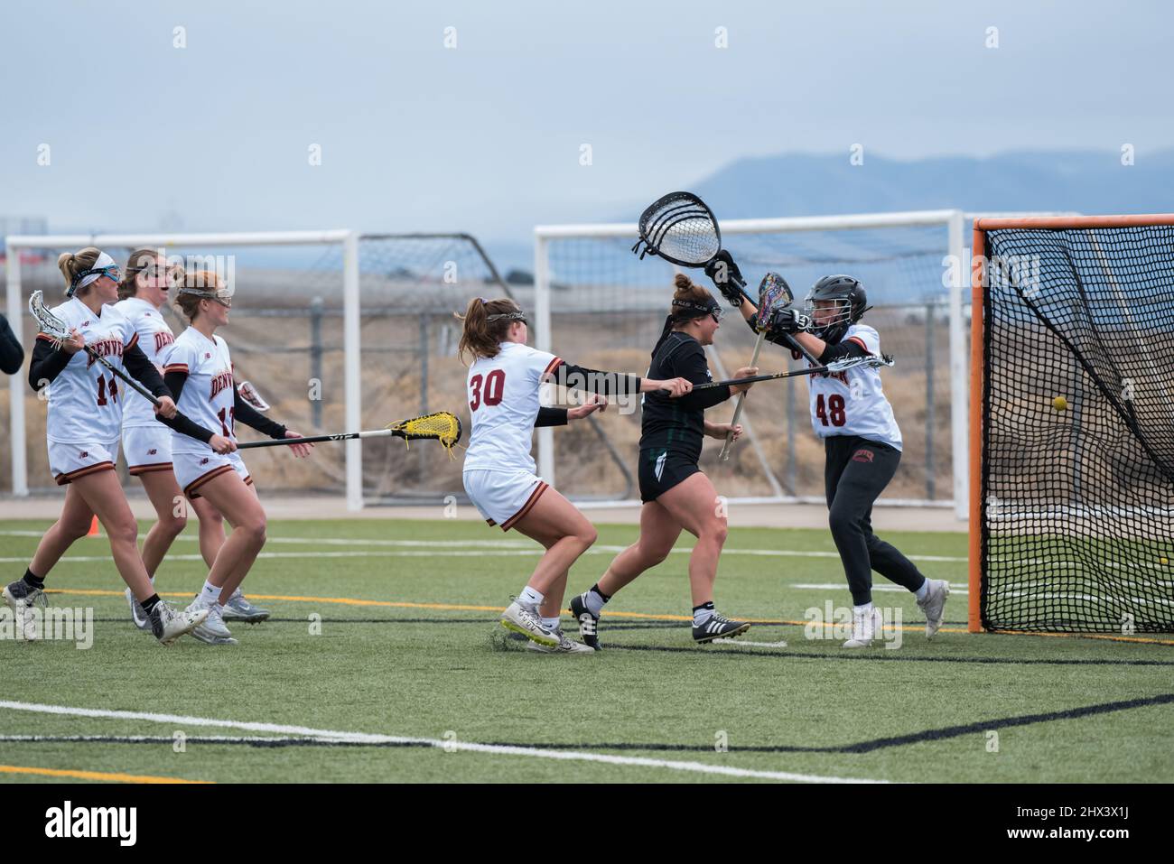 Vineyard, Utah, USA - March 5, 2022.  The intensity and athleticism of women's LaCrosse.  Speed, coordination, and toughness is required in this sport. Stock Photo