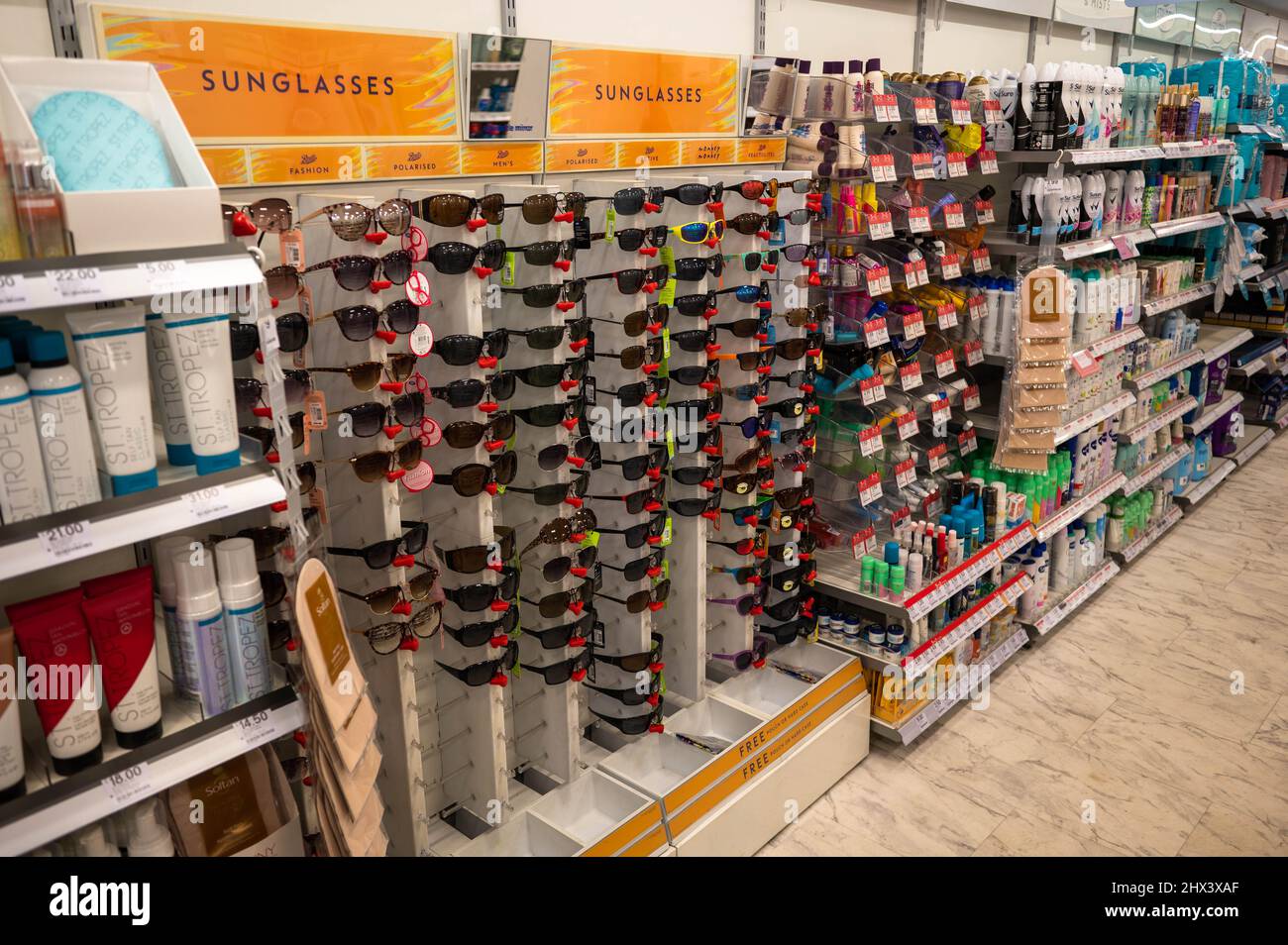 Boots the chemist aisle with varied types of sunglasses for sale Stock