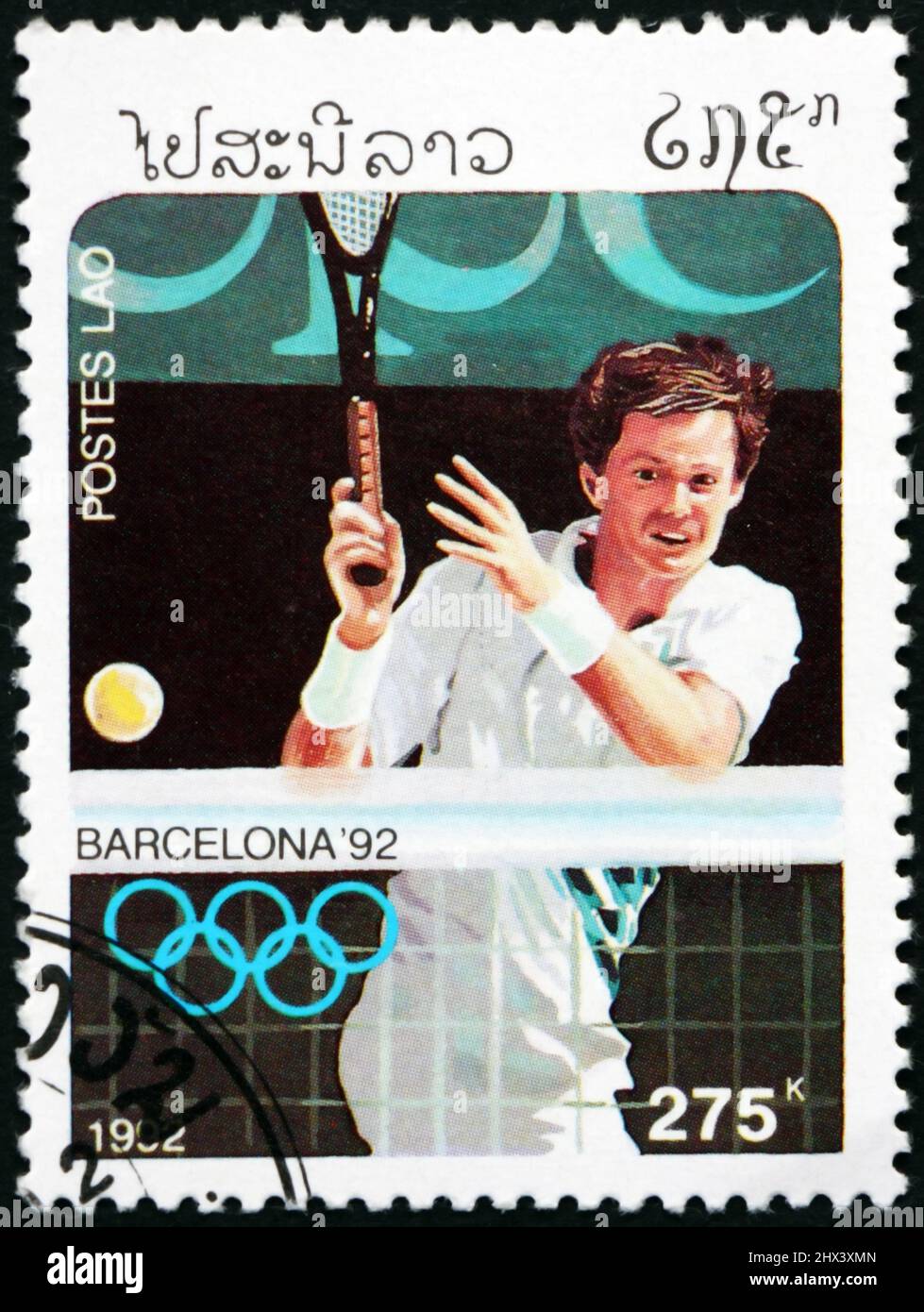 LAOS - CIRCA 1992: a stamp printed in Laos shows tennis, 1992 Summer Olympics, Barcelona, circa 1992 Stock Photo