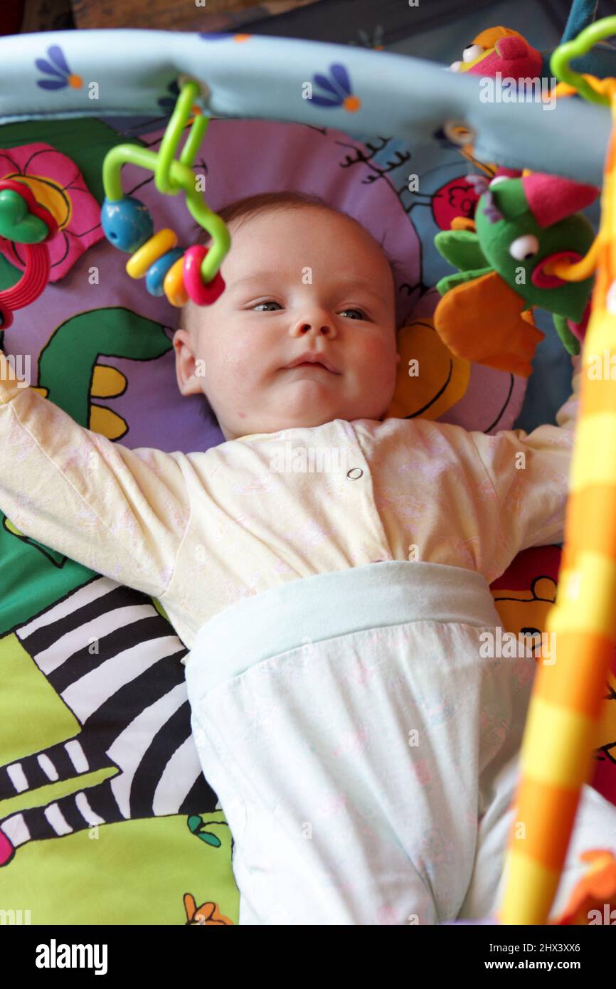 The baby is lying on the Stock Photo Alamy