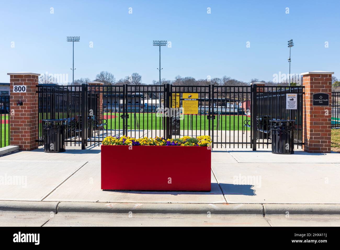 GASTONIA, NC, USA-3 MARCH 2022: Gated entrance to the CaroMont Health Park, the Gastonia Baseball stadium in the FUSE district. Stock Photo