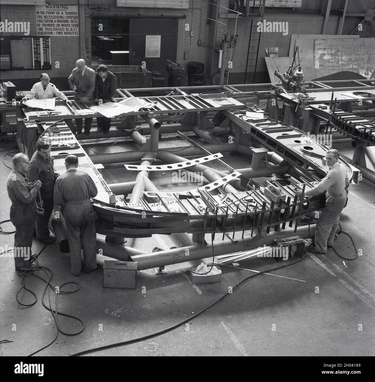 1950s, historical, inside an aviation factory, workers making parts for aircraft at Short Bros, Belfast, Northern Ireland, UK. Stock Photo