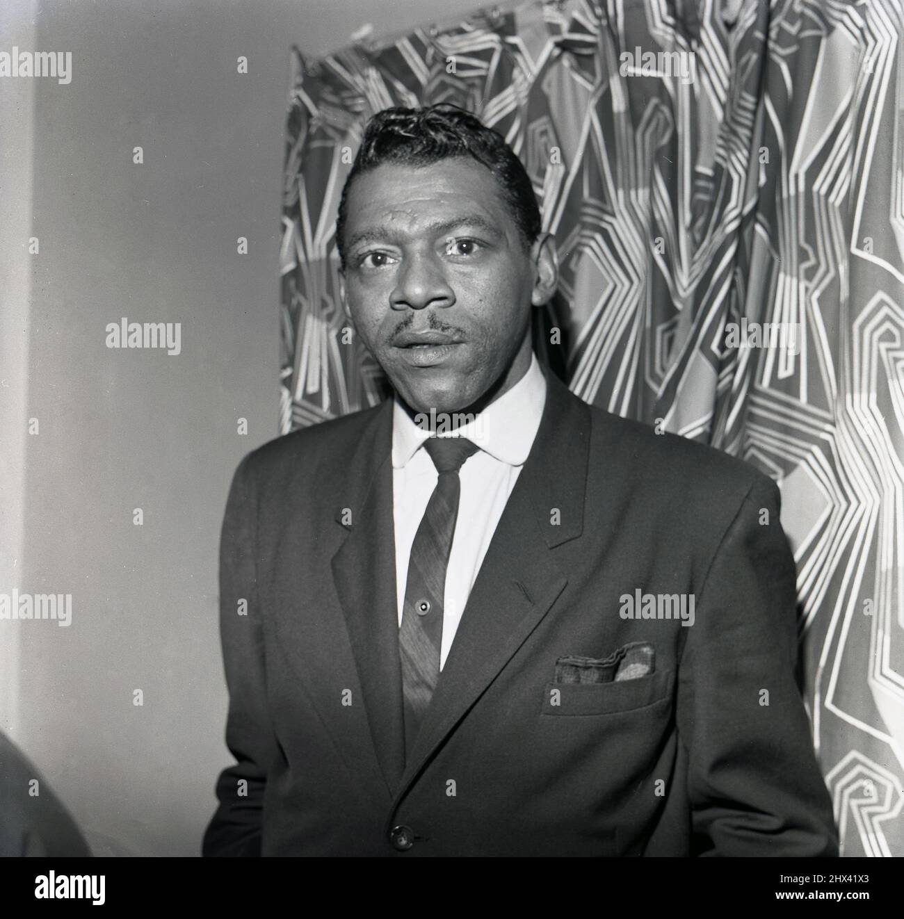 1964, historical, American musician, blues singer and harmonica player Little Walter, Borough Assembly Hall, Aylesbury, England, UK. Born in 1930 in Louisiana, USA as Marion Walter Jacobs but known as Little Walter, his blues harmonica play was innovative for its time and set the standard for modern blues and rock harmonica players. in 2008, forty years after his pre-mature death, he was inducted into The Rock and Roll Hall of Fame. Stock Photo