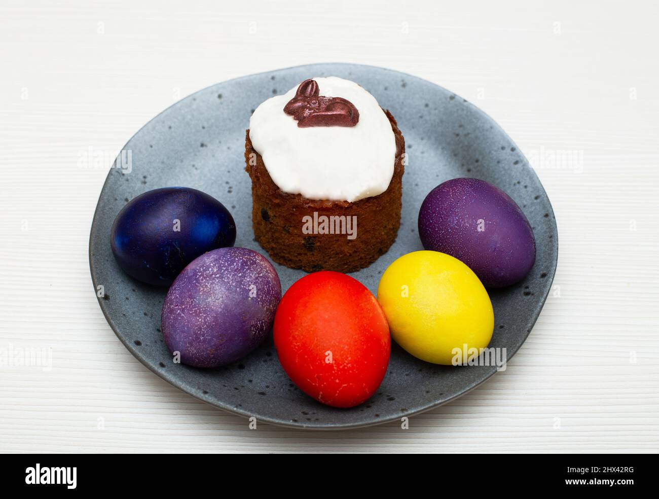 Traditional Easter cake with painted eggs prepared for the celebration of Easter. Stock Photo