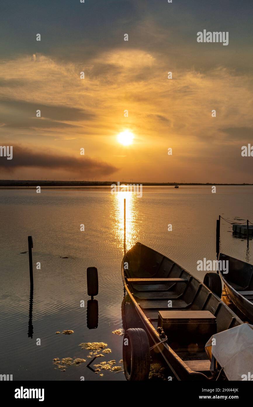 Beautiful background with boats in the lake at sunset Stock Photo - Alamy