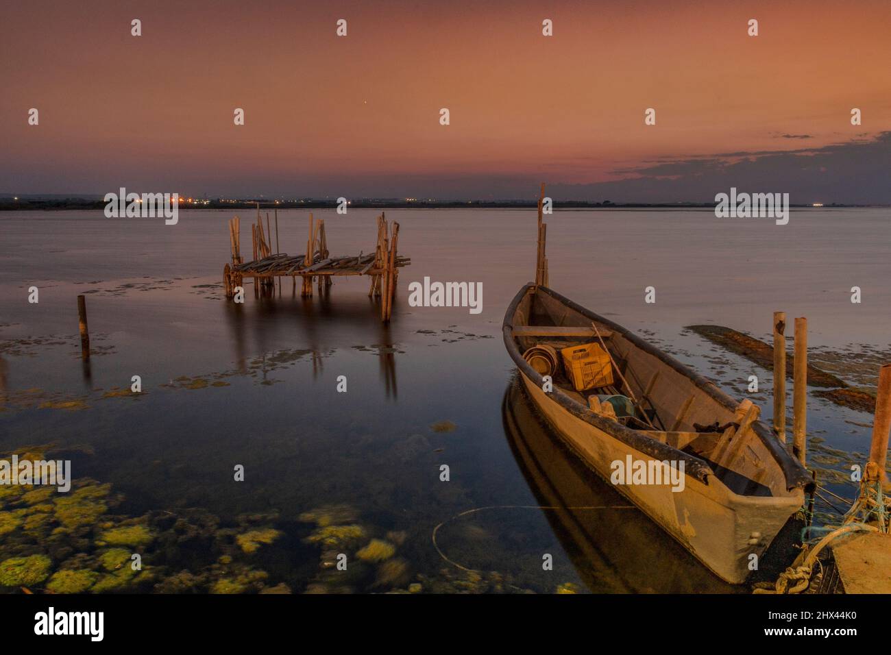 Beautiful background with boats in the lake at sunset Stock Photo - Alamy