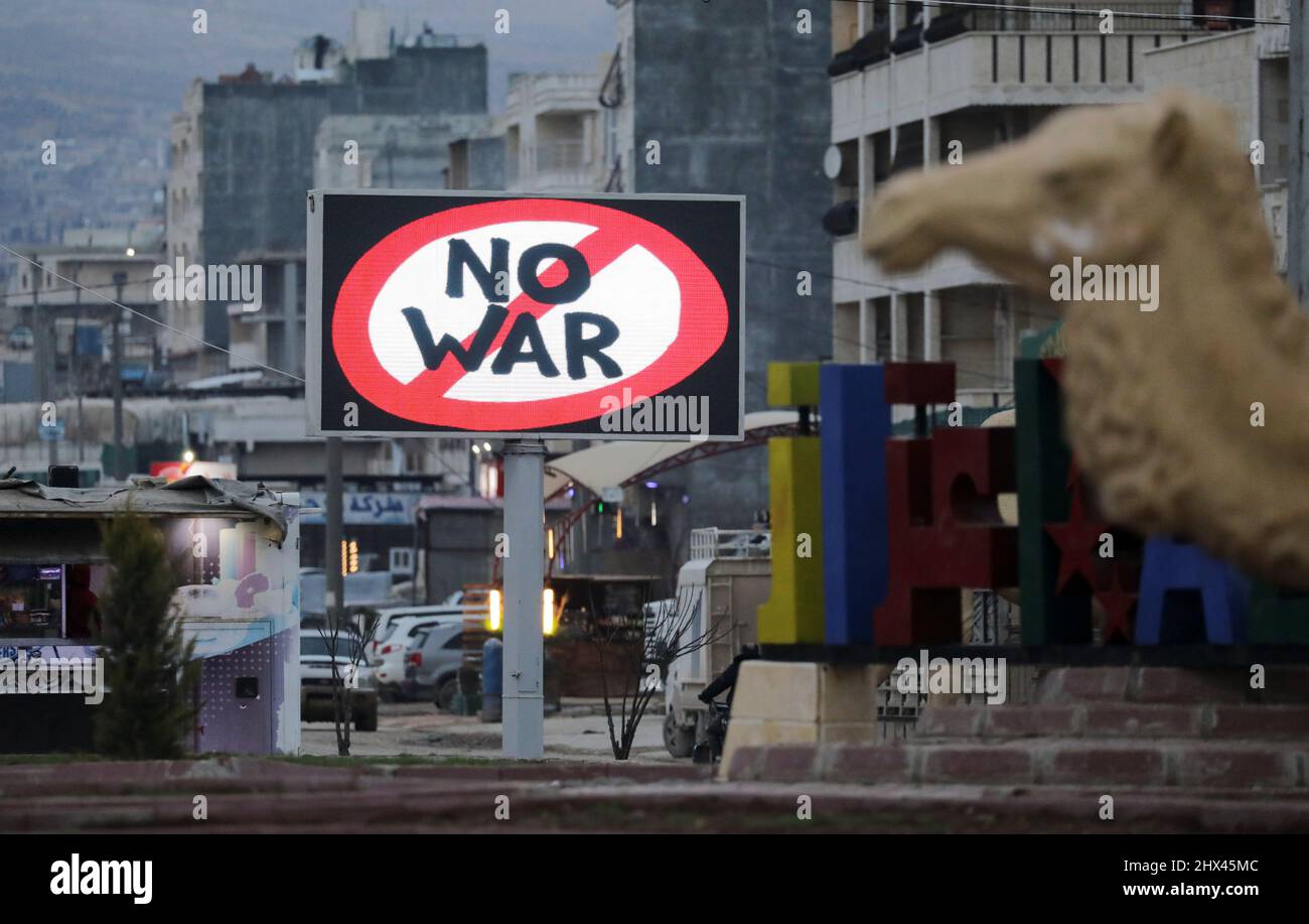 An electronic billboard reading 'No war' in support of Ukraine amid Russia's invasion is seen in the rebel-held city of Azaz, Syria March 9, 2022. REUTERS/Khalil Ashawi Stock Photo
