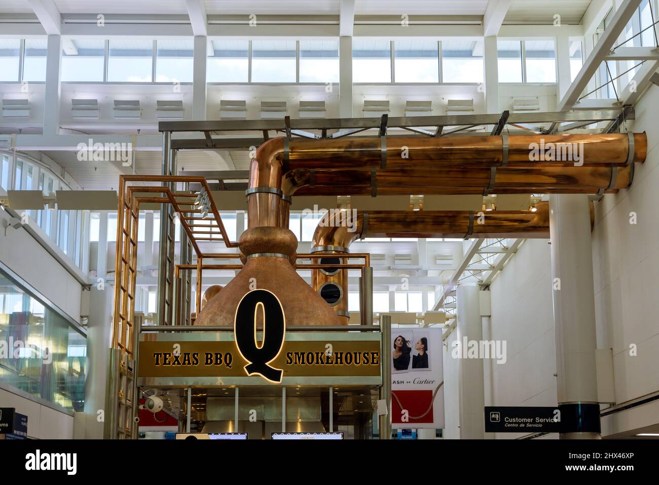 Airport flight gate, shop, Texas BBQ Smokehouse restaurant lounge terminal in Houston Texas