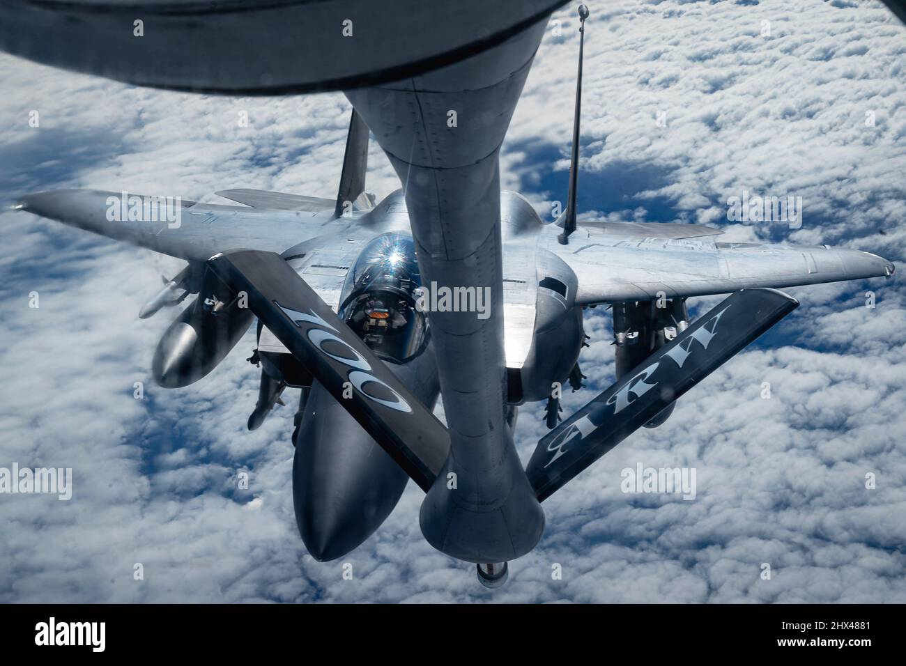 February 26, 2022 - Ramstein Air Base, Rheinland-Pfalz, Germany - A U.S. Air Force Boeing KC-135 Stratotanker provides fuel to an F15E Strike Eagle over Eastern Europe, Feb. 26, 2022. The 100th Aerial Refueling Wing assigned to Royal Air Force Mildenhall is currently operating missions out of Ramstein Air Base, Germany, providing 24-hour support to NATO allies and partners. Credit: U.S. Air Force/ZUMA Press Wire Service/ZUMAPRESS.com/Alamy Live News Stock Photo