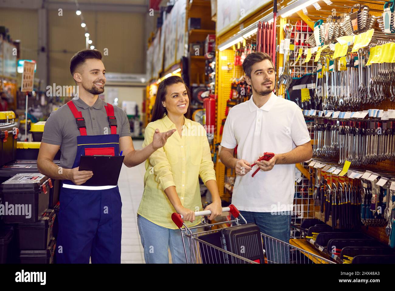 Sales assistant at a DIY store or hardware shopping centre showing