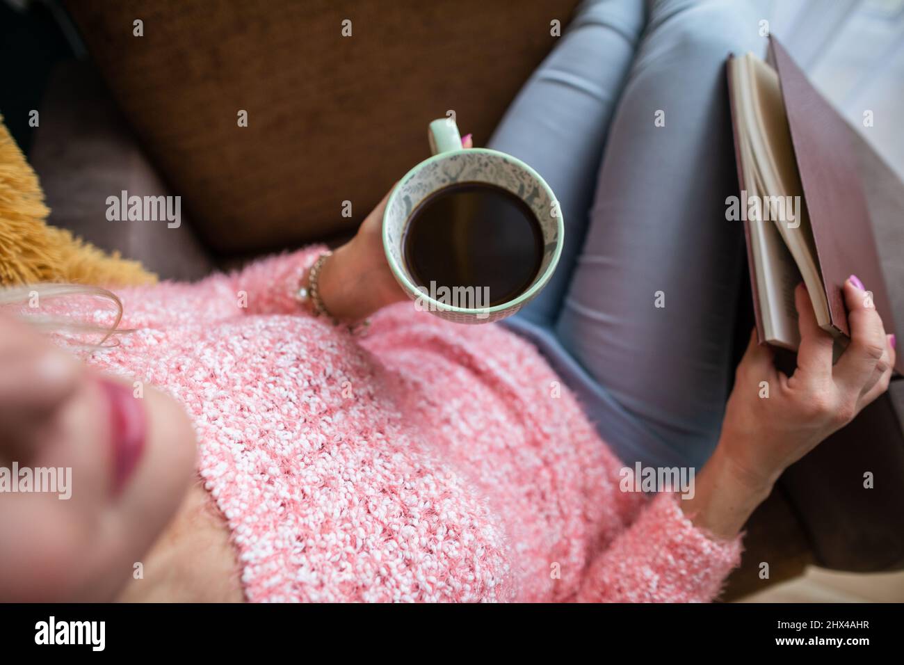 A woman holds a Turkish brewed coffee. View from above. Stock Photo