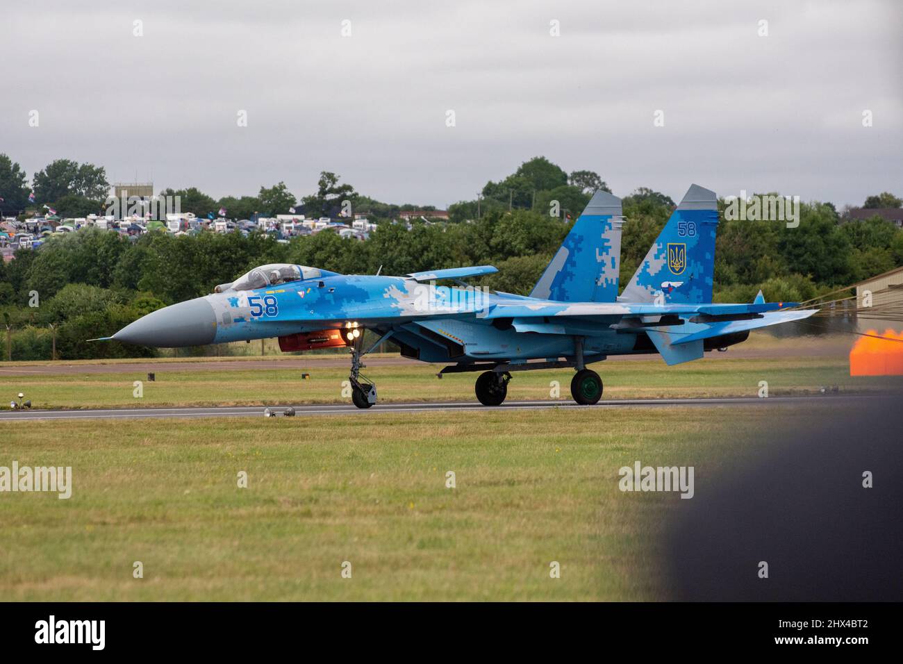 Ukrainian Air force Sukhoi SU-27 Flanker digital blue fighter jet plane flying at speed and displaying combat manoeuvres at the RIAT Airshow in 2017. Stock Photo