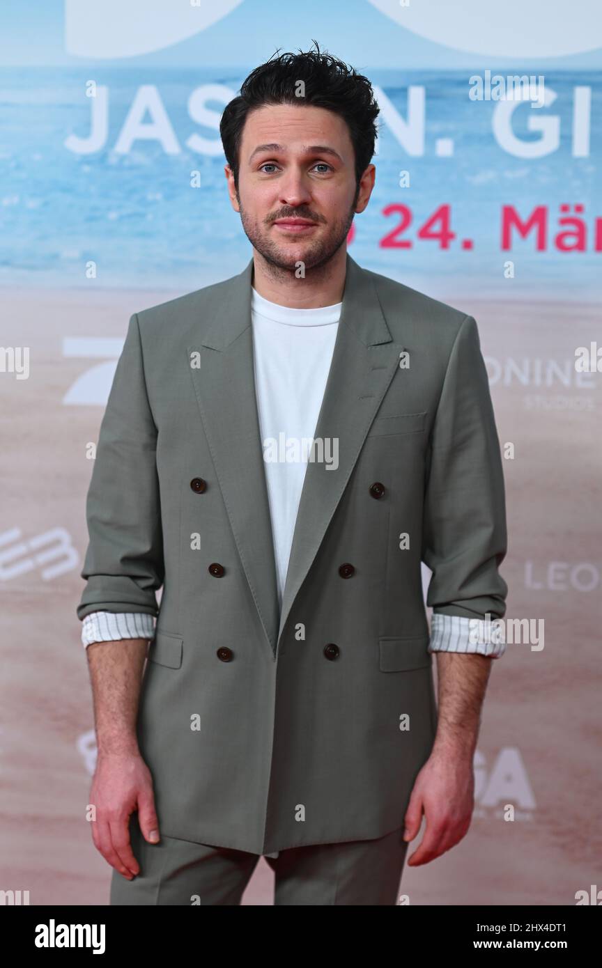 Munich, Germany. 09th Mar, 2022. Actor Dimitrij Schaad stands during the premiere of the film 'JGA: Jasmin. Gina. Anna.' at the Mathäser Filmpalast on the red carpet. Credit: Lennart Preiss/dpa/Alamy Live News Stock Photo
