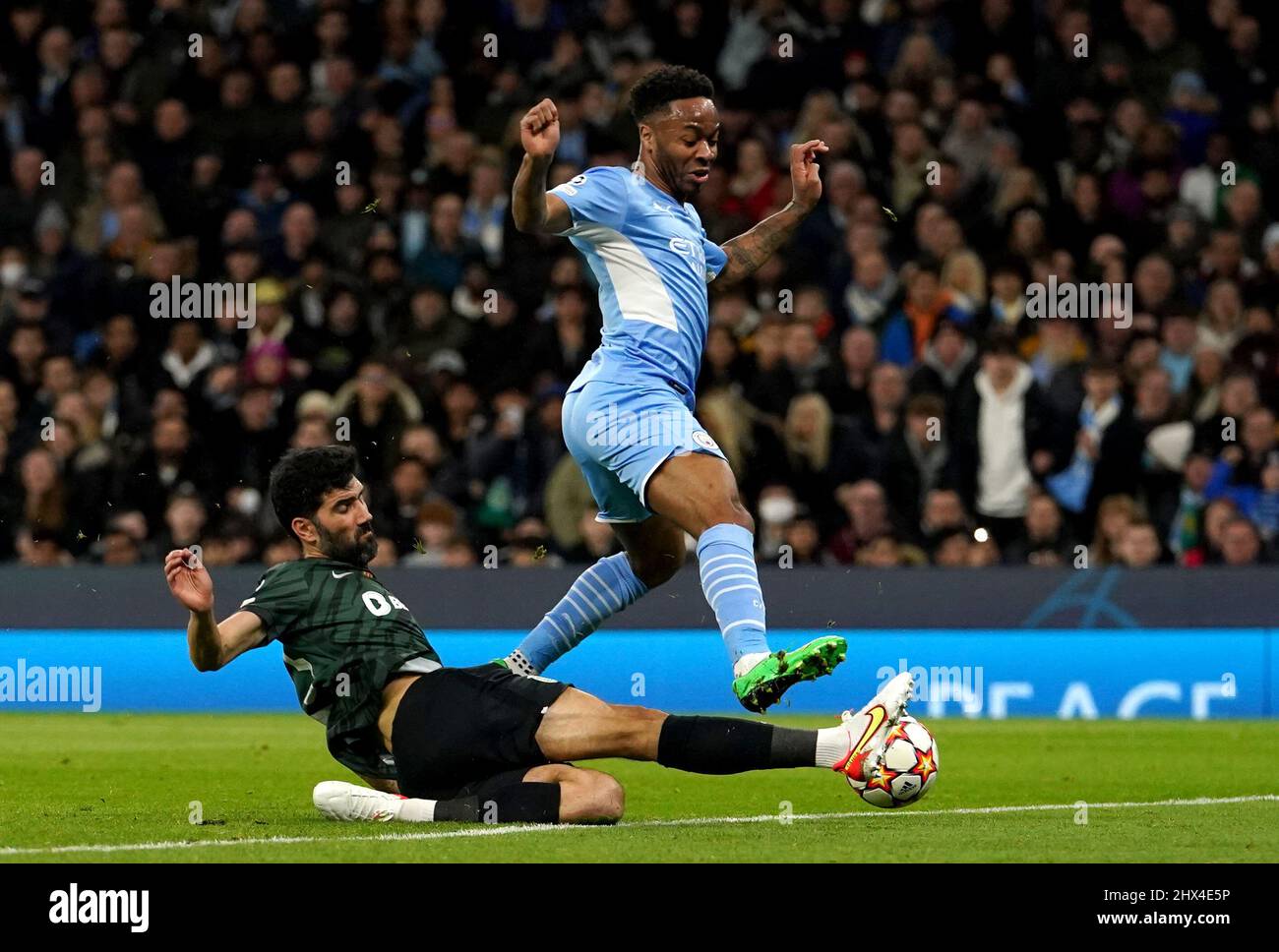 Manchester City's Raheem Sterling (right) and Sporting Lisbon's Luis Neto battle for the ball during the UEFA Champions League round of sixteen second leg match at the Etihad Stadium, Manchester. Picture date: Wednesday March 9, 2022. Stock Photo