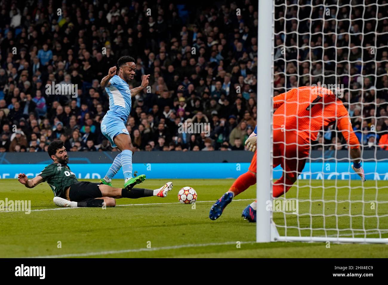 Manchester, England, 9th March 2022.   Raheem Sterling of Manchester City tackled by Luis Neto of Sporting Lisbon during the UEFA Champions League match at the Etihad Stadium, Manchester. Picture credit should read: Andrew Yates / Sportimage Stock Photo