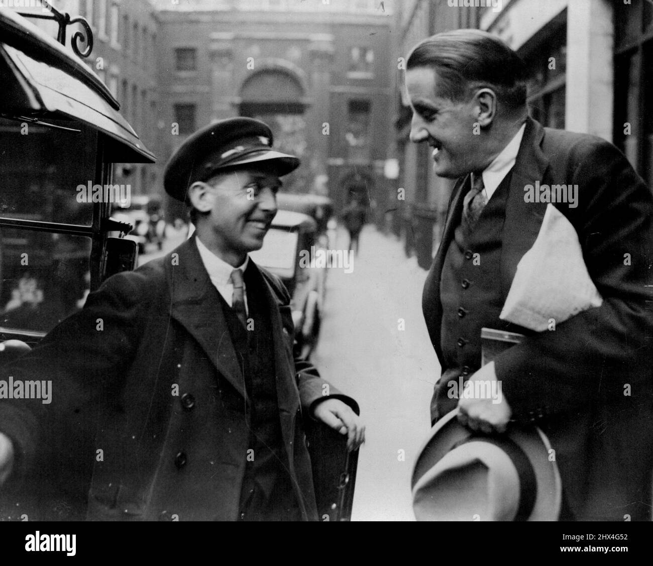 ***** - Hitler's Friend - In London: Dr. Hanfstaengl chatting with a London taxi-driver after leaving his London hotel today. Dr. Ernst ('Putzy') Hanfstaengl, intimate friend of Chancellor Hitler and chief of the Nazi Foreign Press Department, is staying at a London Hotel. Dr. Hanfstaengl outbursts in connection with criticisms in the foreign press of the Nazi regime in Germany. October 28, 1934. (Photo by The Associated Press of Great Britain Ltd.). Stock Photo
