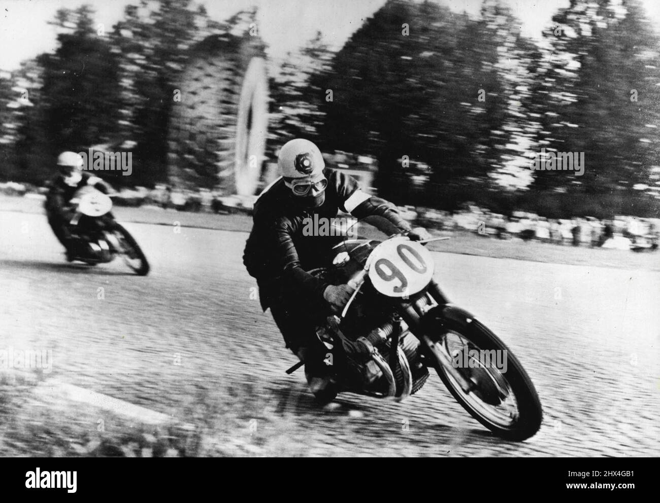 Duke Leads The World -- In the lead... Geoff Duke on a 500 C.C. Gilera, leads the field during the Italian Grand Prix. Geoff Duke, who won the Italian grand Prix at Monza on Sunday, new leads in the 500 class world championships. September 10, 1953. (Photo by Paul Popper, Paul Popper Ltd.). Stock Photo