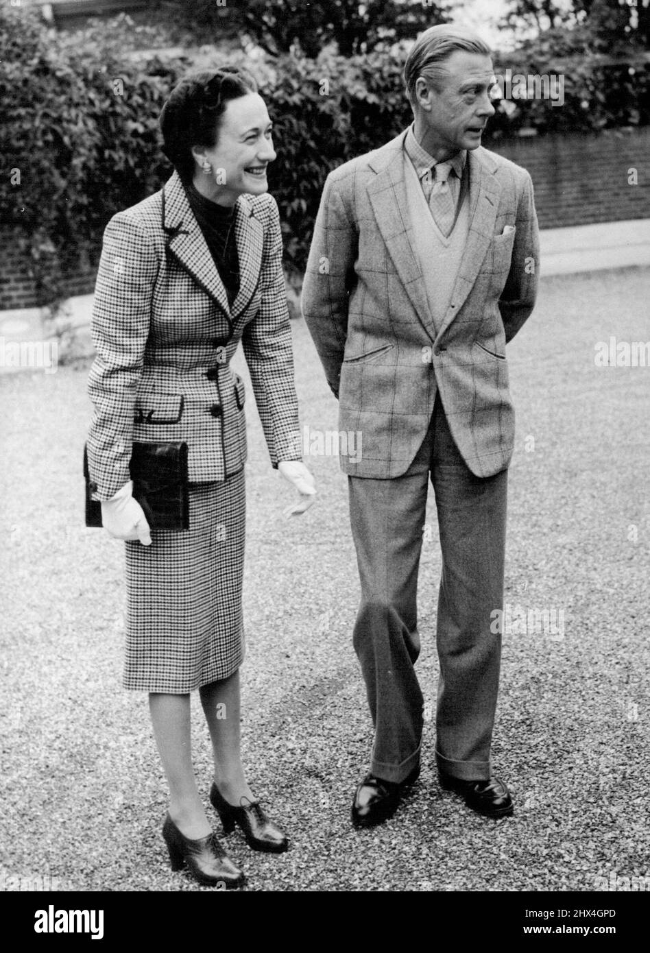 Quiet Week-end for the WindsorPhoto Shows: The Duke and Duchess of Windsor seen enjoying a joke in the grounds of Ednam Lodge, Sunningdale, this morning October 12.The Duke and Duchess of Windsor rested today October 12 after their near-midnight arrival at Ednam Lodge, Sunningdale, from France. They have planned a quiet week-end settling in at the house which has been lent them by the earl of Dudley. Next week they will come to London for some private visits. They will also spend some time at Windsor where much of the Duke's furniture and possessions have seen stored. October 12, 1946. (Photo Stock Photo