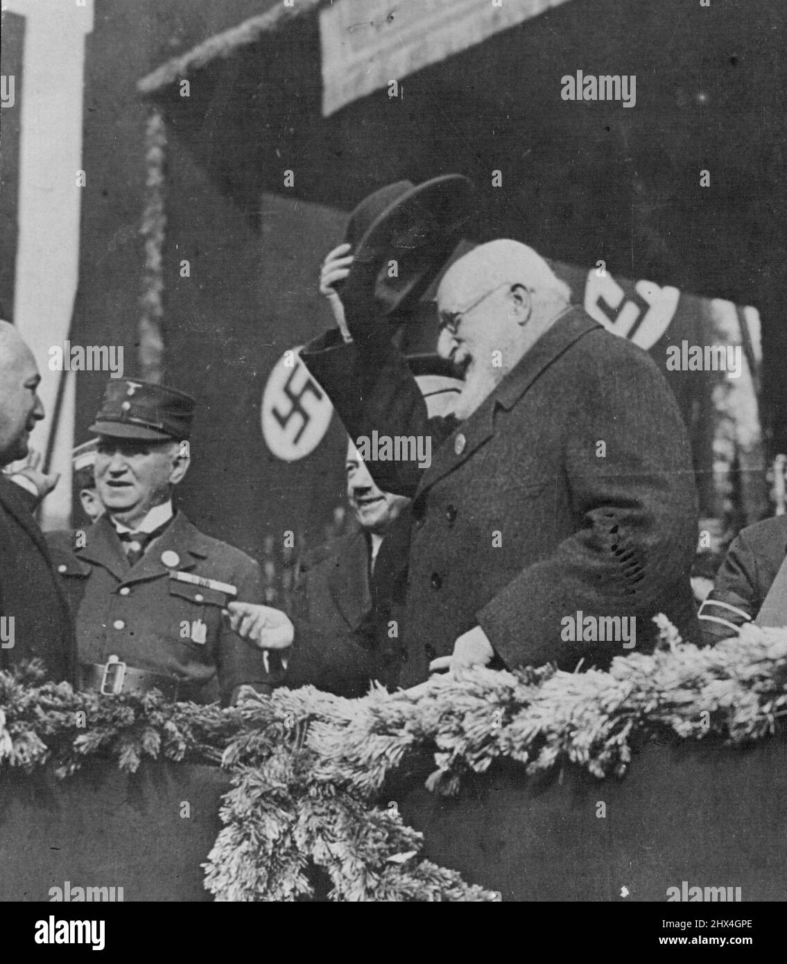 King Ferdinand of Bulgaria participates in Great German 'Day of Art' in Munich - Hitler lays foundation stone of New House of Art. King Ferdinand of Bulgaria, raising hat, next to him is Bishop Di Torre Grossa, her Hitler Laid the foundation stone of the New German House of Art. October 17, 1933. (Photo by News Photo). Stock Photo