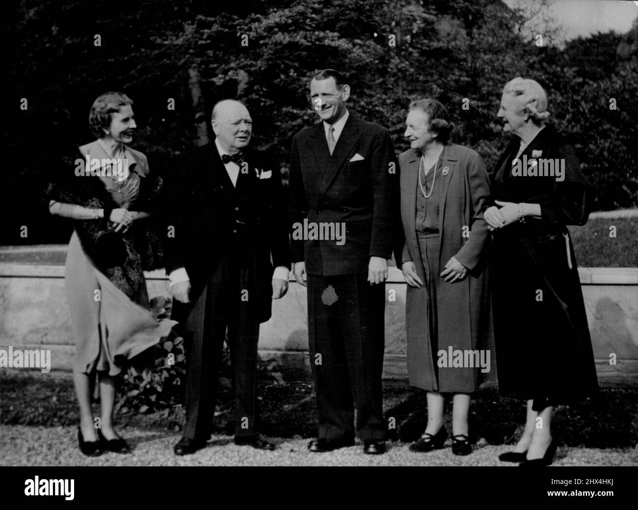 Churchill with King, Queen of Denmark - Left to Right, In the Garden of Fredensborg Castle, 30 miles from Copenhagen, are; Queen Ingrid, Mr. Winston Churchill, King Frederick, The Dowager Queen Alexandrine, and Mrs. Churchill, Oct 10. The Churchill's Guests of The Danish Resistance Movement, are staying at the Castle with the King and Queen of Denmark, during their Three-Day Visit. October 11, 1950. (Photo by Asociated Press Photo). Stock Photo