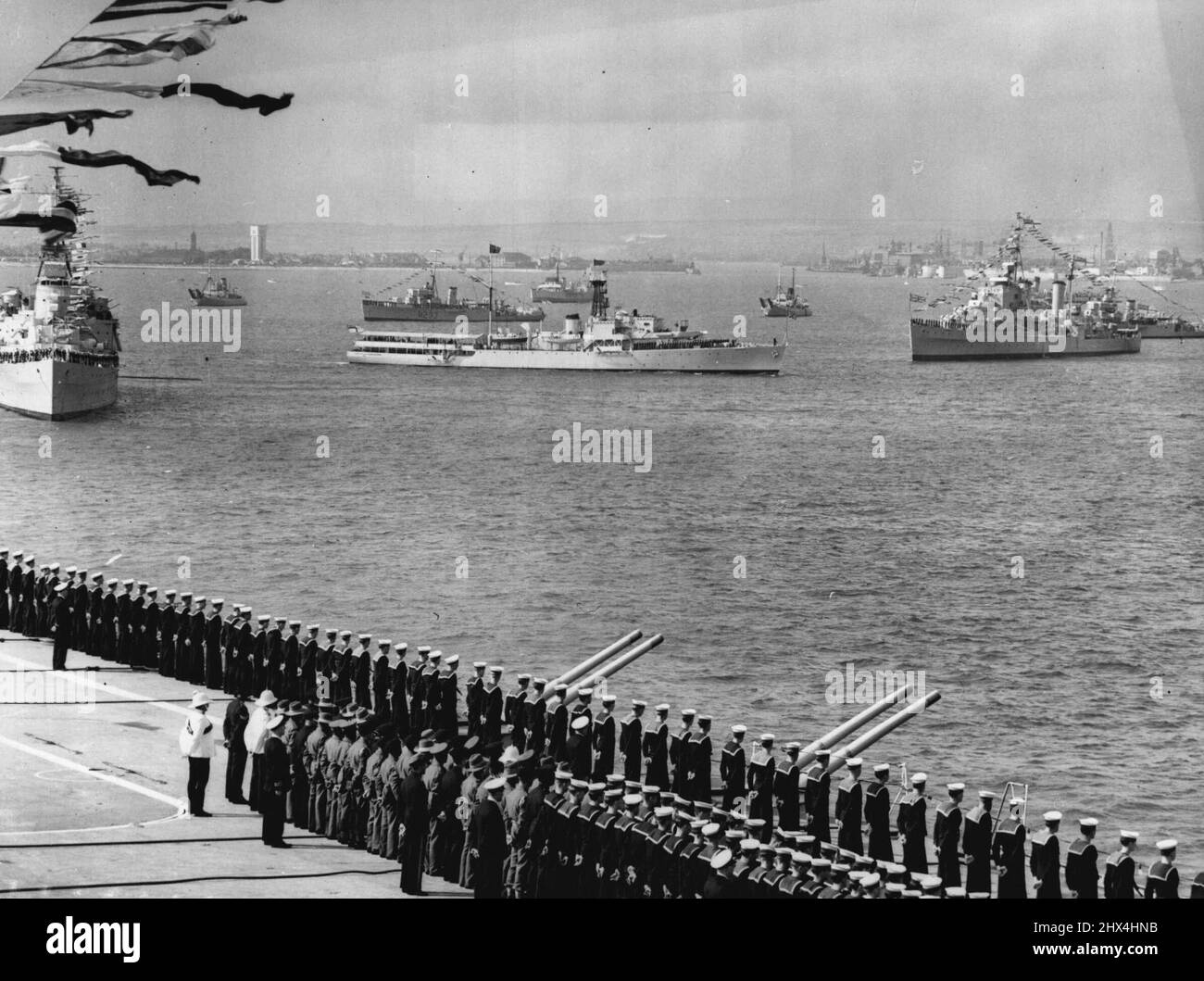 Eaglets Salute The Queen - Crew Of The Eagle, Britain's Latest And Greatest Aircraft  Carrier Man Ship As The Queen, Aboard The Royal Yacht, The Dispatch Vessel  Surprise, Passes Along The Lines