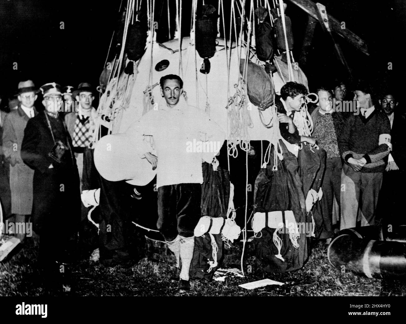 Stratosphere Ascent -- Two Belgium scientists, Professor Max Cosyns and his Assistant ***** Van Der Elst, who took off from Belgium for a stratosphere ***** and were fore some time considered lost. Have come down in ***** after it is said reaching a height of 26,000 Meters. Professor Max Cosyns photographed a moment before his departure. M. Van Der Elst can be seen leaning out of one of the portholes of the gondola. October 1, 1934. (Photo by Sport & General Press Agency Limited). Stock Photo