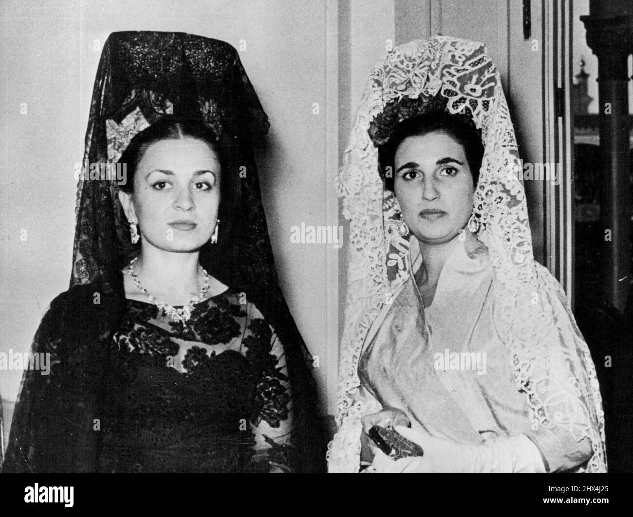 First Ladies -- Queen Dina of Jordan and Madame Franco wearing beautiful lace Mantillas when they attended one of the many receptions in Madrid this week in honour of King Hussein and Queen Dina, who will be arriving in this country next week. June 10, 1955. (Photo by Paul Popper, Paul Popper Ltd.). Stock Photo