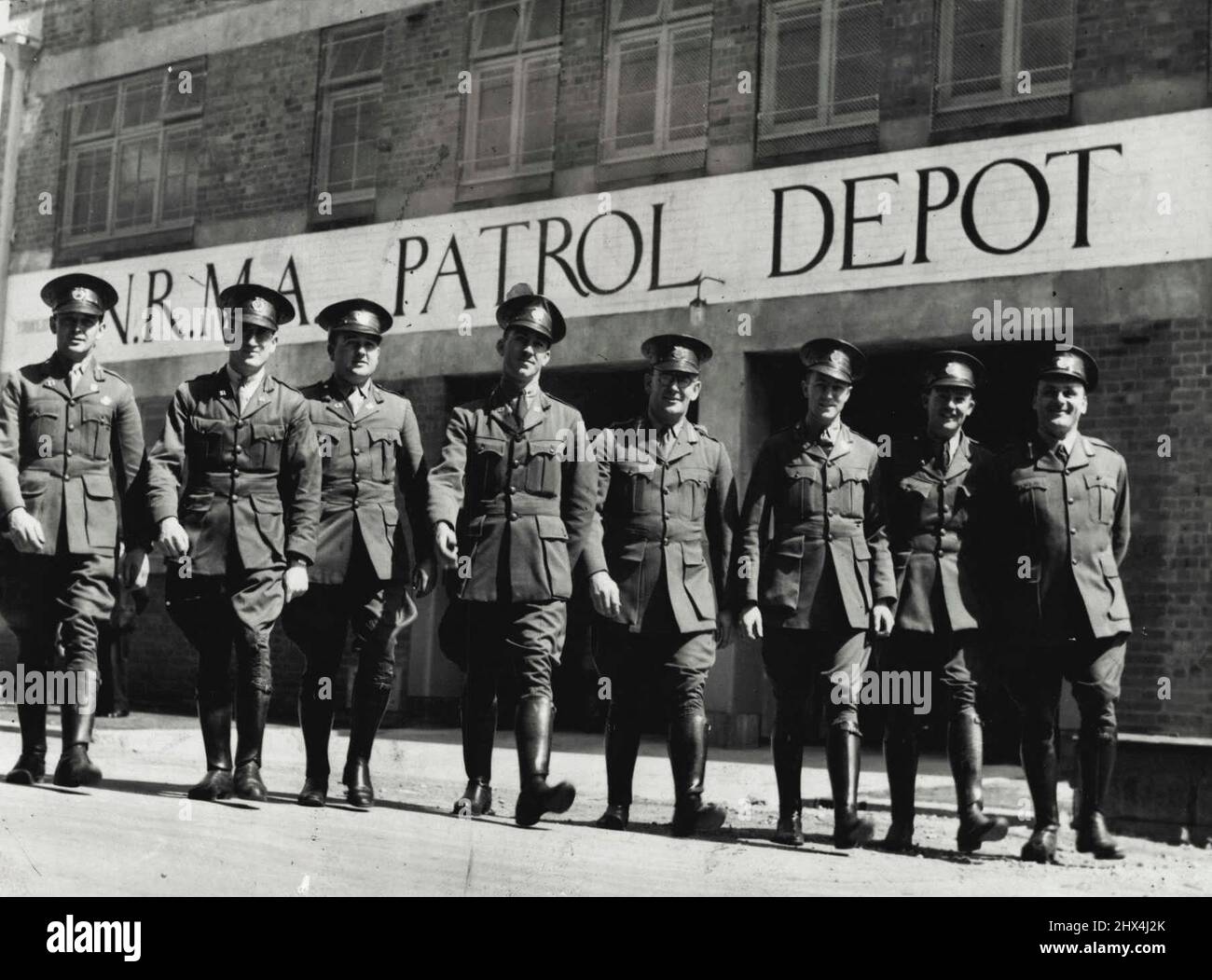 President of the N.R.M.A. (Mr. J. C. Watson) officially opened new patrol ***** of the association at Woollomooloo yesterday. Patrolmen leaving the building after the ceremony. September 17, 1937. Stock Photo