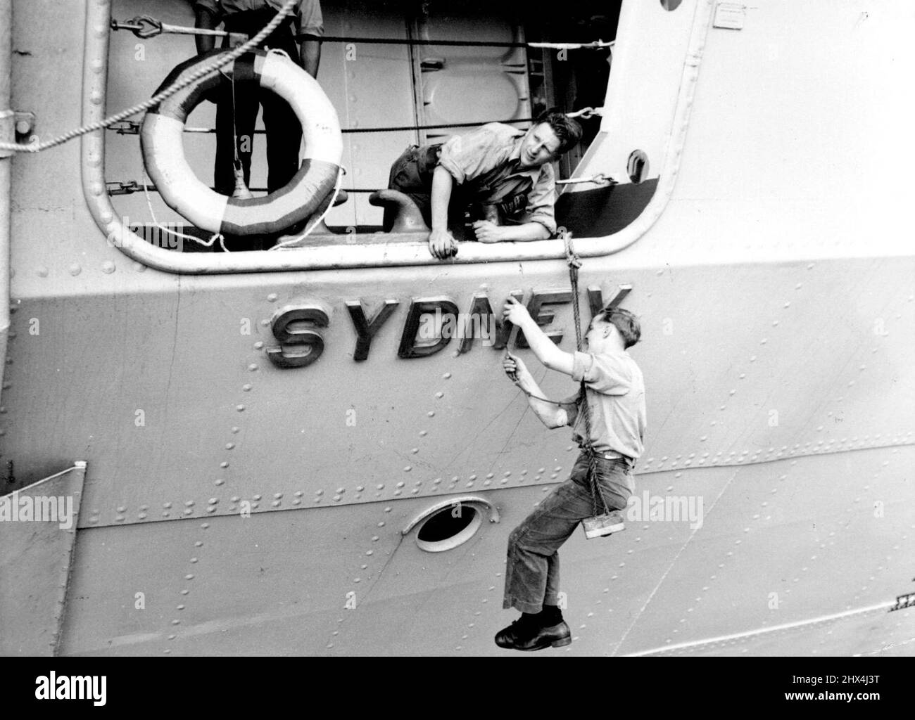 Sydney at Fremantle. Cleaning brightwork of salt spray, one of first