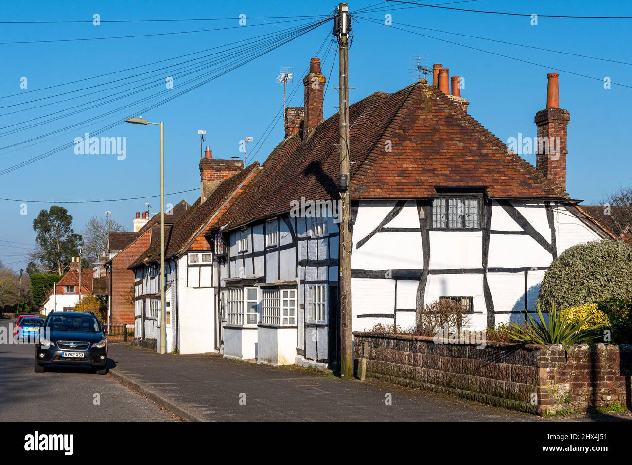 Houses in Holybourne, a pretty Hampshire village, England, UK, on a sunny spring day with blue sky Stock Photo