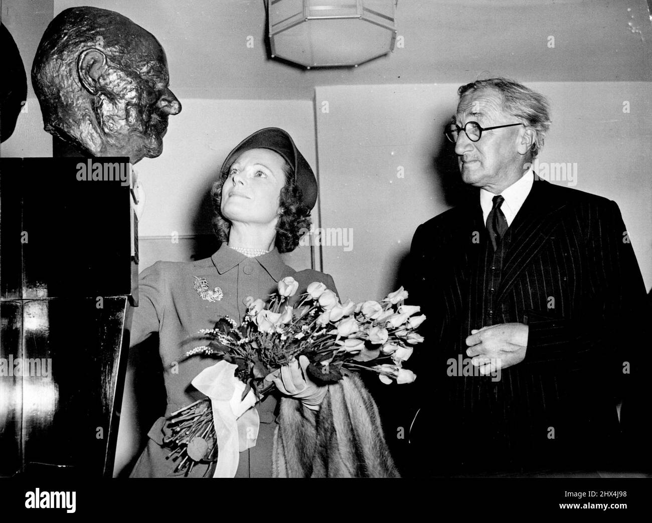 Tribute To C. B. ***** Sir Alan Herbert, M.P., who was closely sentenced with the great showman, with Anna Neagle, a former ***** Young Lady, after she had unveiled the bust of C.B. in the foyer of the Adelph Theatre today. Sir Alan Herbert - 'It does not worry me that Australians say 'aw' instead of 'oh'. Who are we to talk of accents'?. November 02, 1955. Stock Photo