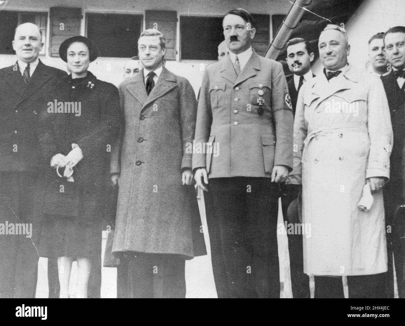 Photo Shows:- The Duke and Duchess of Windsor Photo graphed with Herr Hitler outside Der Fuehrer's mountain retreat. On right of Hitler is Dr. Ley, Leader of the German Labor Front. Duke and Duchess of Windsor Visit Hitler Two - Hour Talk at his Mountain Retreat:The Duke and Duchess of Windsor yesterday visited Hitler in his mountain home at Berchtesgaden. They took him tea with him and talked with him for two hours: After their arrival at Berchtesgaden station the visitors first drove to Koenigsee, Bavaria's most beautiful mountain lake. October 23, 1937. (Photo by The International Graphic P Stock Photo