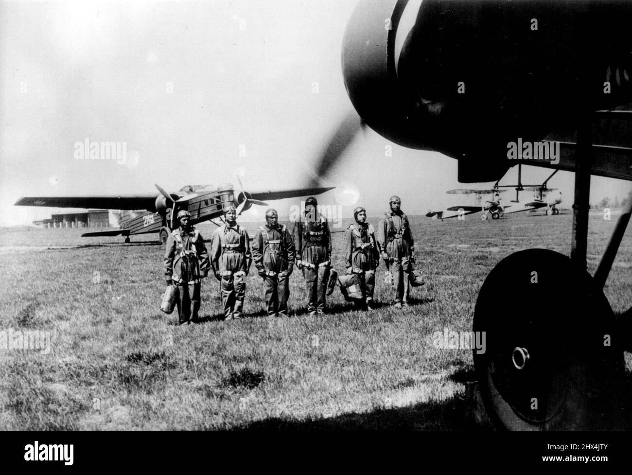 Czech Air Force Stands by During Crisis, Reserves called up. Czechoslovakian Air Force pilots in full kit with their machines on the military aerodrome near Prague. These pictures were made at a military aerodrome near Prague as pilots of the Czechoslovakian Air Force stood by in case of emergency as the tension between Germany and Czechoslovakia, intensified by the shooting of two Germans on the frontier, increased. Reports were circulated of troop movements in both Czechoslovakia and Germany before the municipal elections took place. Czechoslovakia called up 80,000 reservists. May 23, 1938. Stock Photo