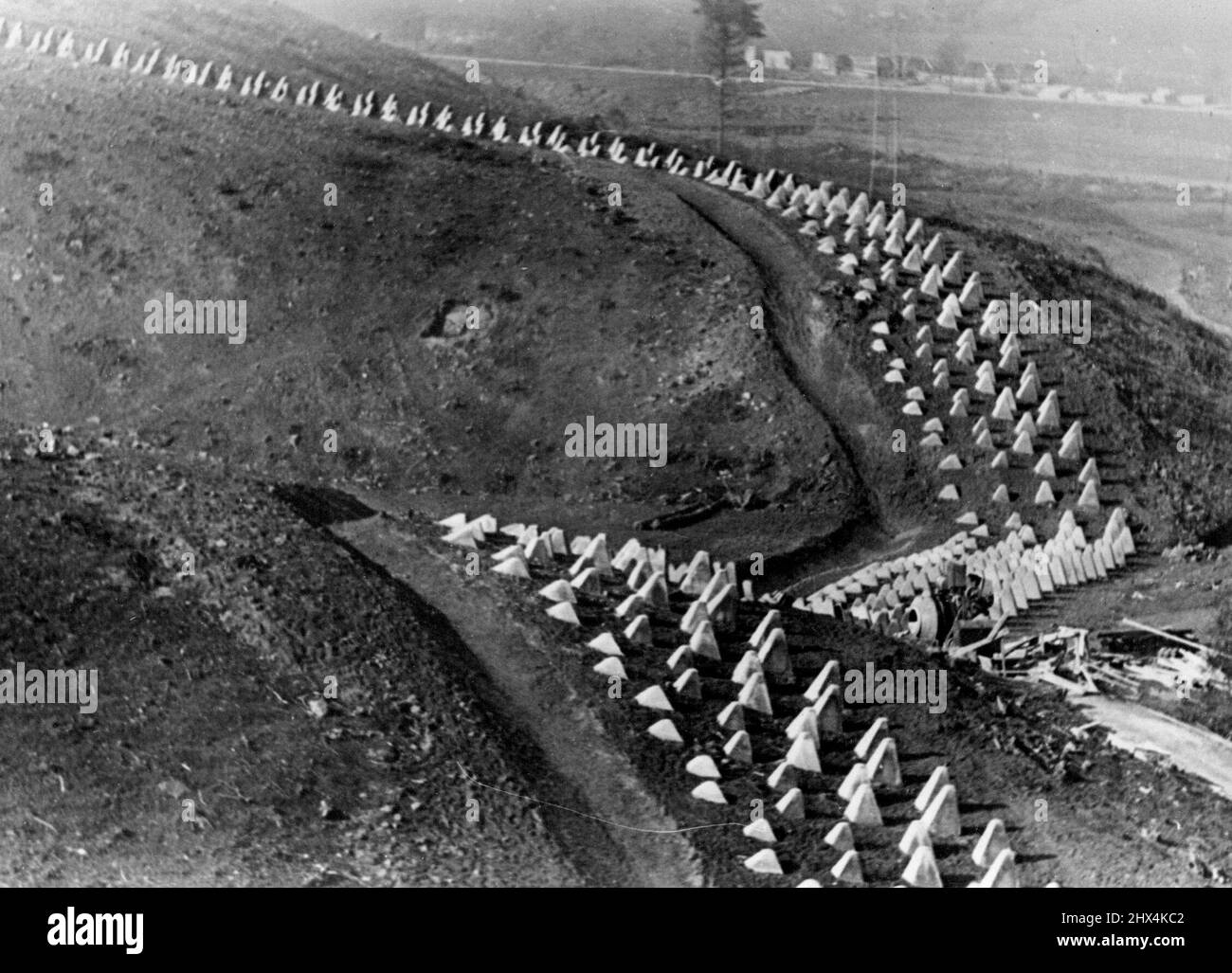 First Pictures Of Germany's Siegfried Line -- Over hill and down dale stretch these lines of reinforced concrete tank barriers - described as the gravestones of tanks. These are the first pictures of Germany's new Siegfried line fortifications along that Western frontiers, described as 'The most modern ad astounding works of our time'. October 25, 1938. (Photo by Keystone). Stock Photo