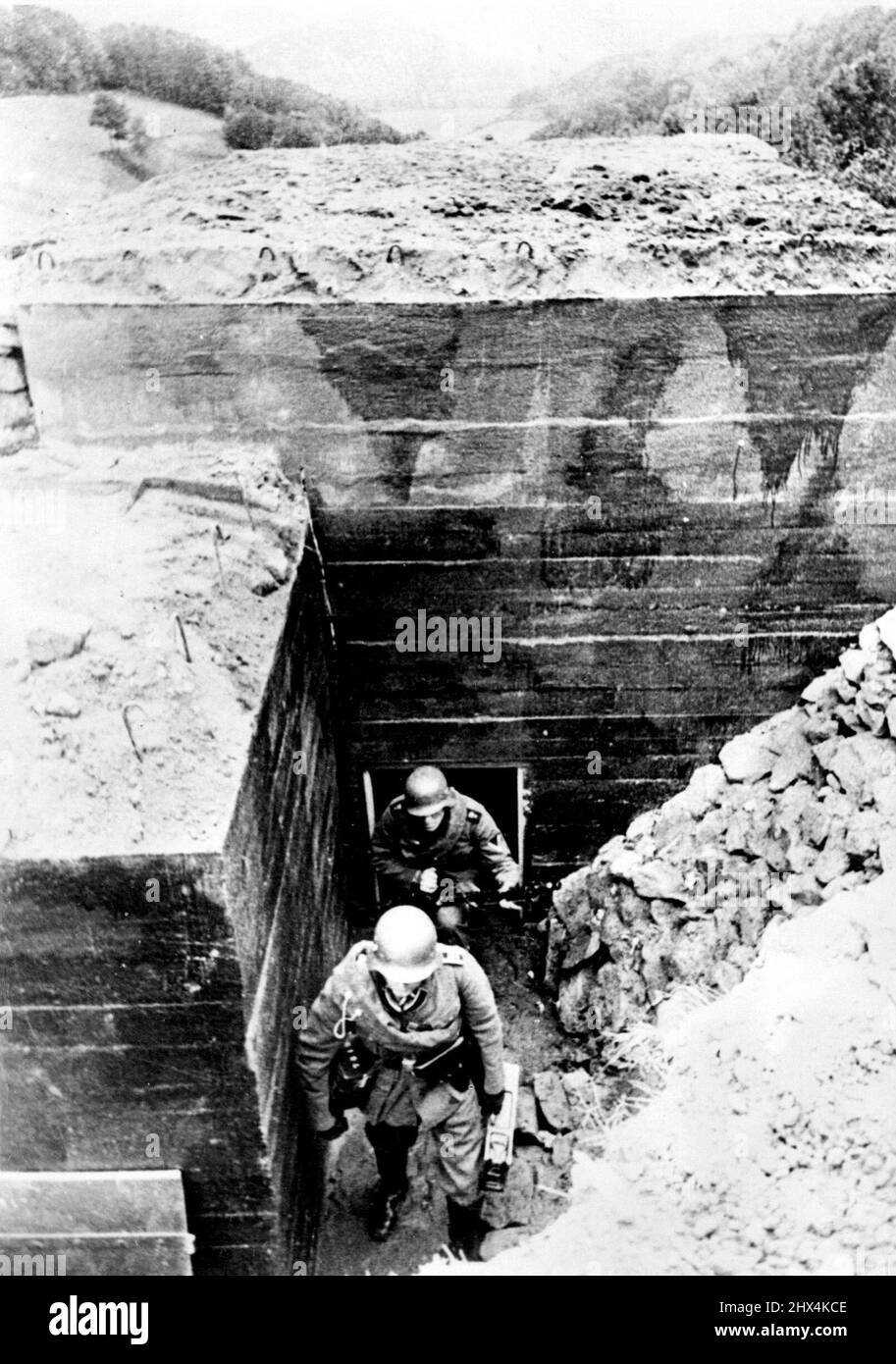 First Pictures Of Germany's Siegfried Line -- Members of a machine gun corps leaving their underground emplacement. These are the first pictures of Germany's new Siegfried line fortifications along that Western frontiers, described as 'The most modern ad astounding works of our time'. October 25, 1938. (Photo by Keystone). Stock Photo