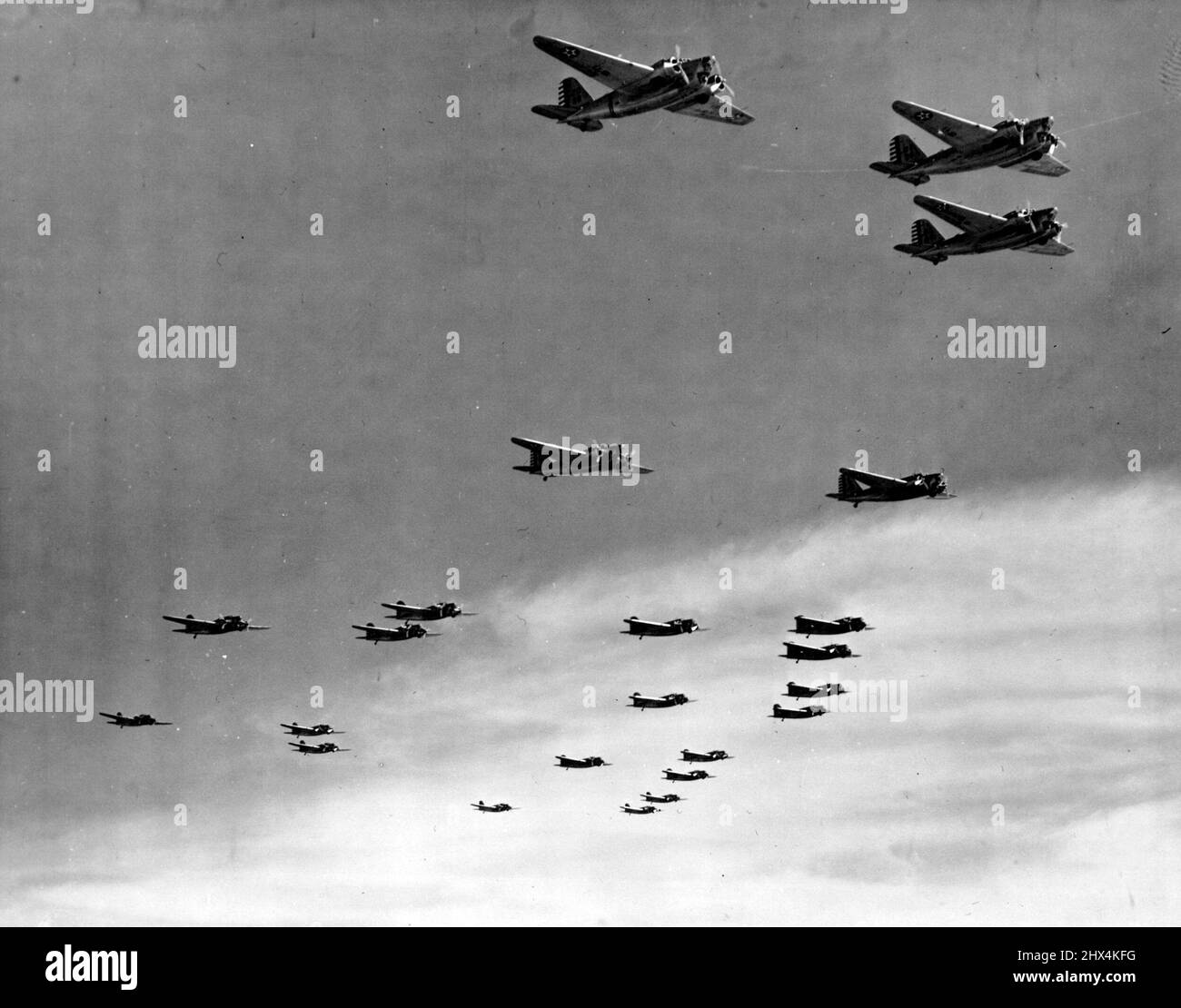 On Peaceful Mission -- Four squadrons of the ninth bombardment group, two motored ships of the Douglas B-18 type from Mitchell Field, New York, drone high over gravelly point on the Potomac during an air show highlighting the dedication by president Roosevelt Sept. 28 of the $12,500,000 Washington, D.C. Airport. In a speech Roosevelt said the united states was building a defense Capable of overcoming any attack. September 28, 1940. (Photo by Associated Press Photo). Stock Photo