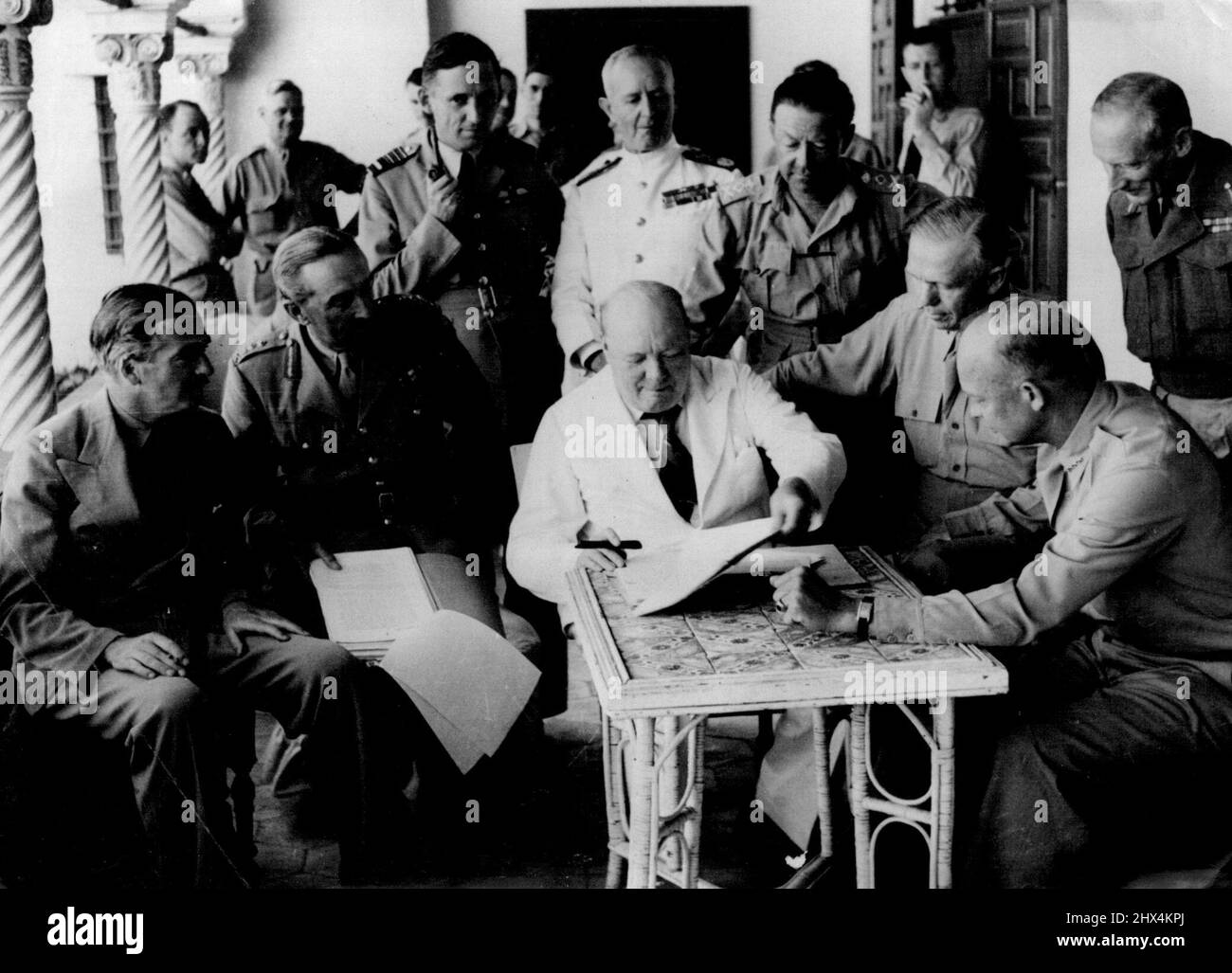 Churchill In North Africa At The Allied Planning Conference -- Left to right: Mr. Anthony Eden, Sir Alan Brooke, Air Chief Marshal Tedder, Admiral Sir Andrew Cunningham, General Alexander, General Marshall, U.S.A. General Eisenhower and General Montgomery: the Prime Minister is seen in the centre. Exclusive photograph taken at Allied Force Headquarters during the occasion of an Allied Planning Conference presided over by the Prime Minister with the Fighting Chiefs of Great Britain and U.S.A. June 1, 1943. (Photo by British Official Photograph). Stock Photo