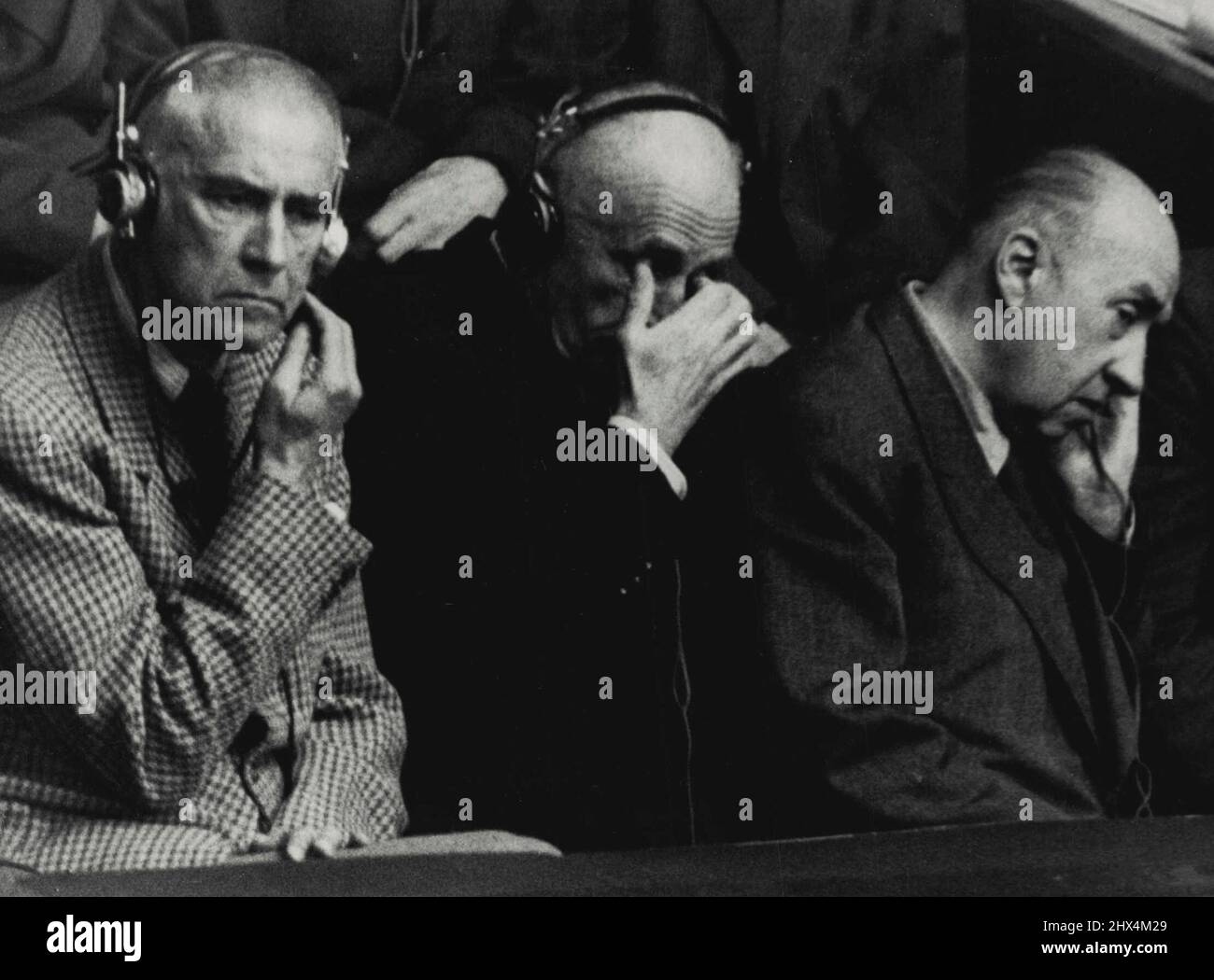 Nazi Criminals hear their fate -- Dramatic study in expressions of three of the Nazi war criminals upon whom the Tribunal pronounced sentence at Nuremburg today. they listened to the verdicts during the morning session. From Left to Right: Wilhelm Frick, Sentenced to Death and Walter Funk sentenced to life imprisonment. October 9, 1948. (Photo by Associated Press Photo). Stock Photo