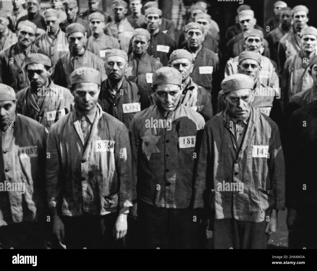 Pastor Hall (Niemoller) -- Soon they are put into dirty grey brown uniforms. The prisoners are given distinguishing marks according the their 'crimes'. February 22, 1950. (Photo by Douglas Slocombe, Black Star) Stock Photo