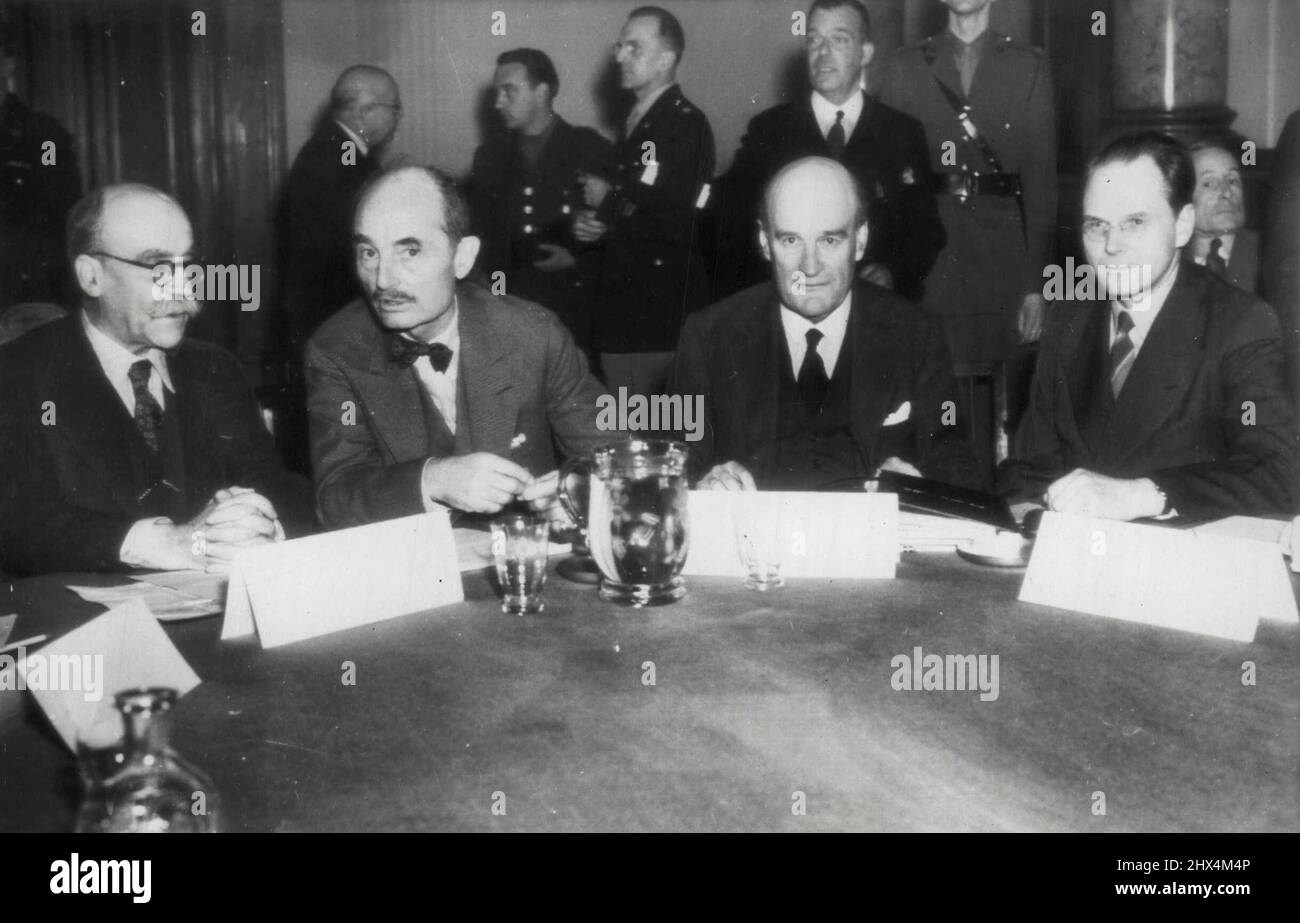 Judges Who Will Try Nazi War Criminals -- The four judges of the international war crimes Tribunal, Set up to Judge 24 Germans -- Members of Adolf Hitler's Nazi Hierarchy -- at Nuremberg on charges of crimes against humanity and world peace, sit together at their first meeting in Berlin. Left to right, they are: M. Donnedieu de Vabres, France; Francis J. Biddle, United States; Lord Justice Lawrence, Great Britain, and Maj. Gen. I. J. Nikitcenko, U.S.S.R. Formal indictments against the Nazis are expected to be handed down *****. October 15, 1945. (Photo by AP wirephoto). Stock Photo