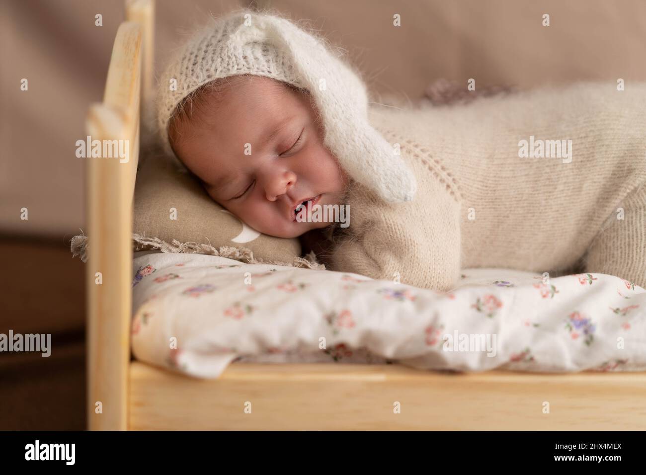 A newborn baby sleeps in a crib, the concept of motherhood, family