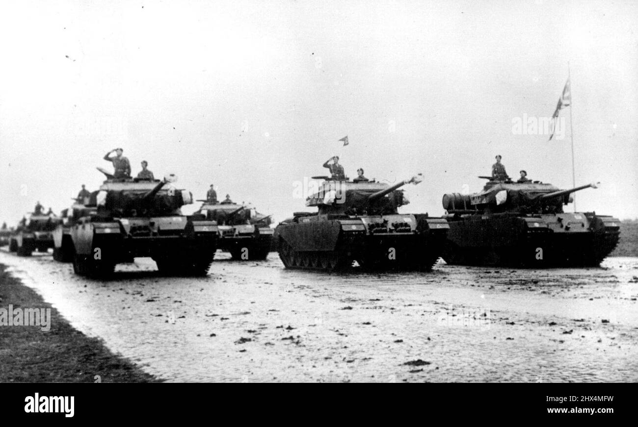 Minister Of Defense In Germany -- 50 ton Centurion tanks passing the saluting base during the parade. Britain has now almost completed her build-up of ground reinforcements in Germany, and the infantry and armoured divisions fulfilling the North Atlantic Treaty commitments are now stationed in the British zone of Germany. Mr. Shinwell, Britain's Minister of Defence, paid a special visit to witness the first parade of the newly arrived 11th Armoured Division at Sennelager. May 6, 1951. (Photo by Sport & General Press Agency, Limited.). Stock Photo