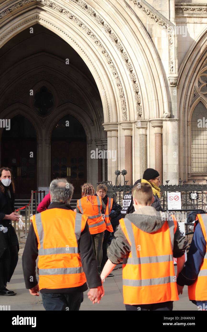Insulate Britain protestors at The Royal Courts of Justice- Glued hands in protest against Climate change 01/02/22 Stock Photo