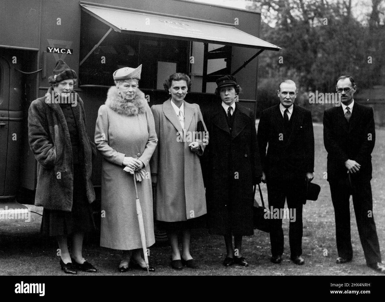 Queen Mary Sees Y.M.C.A. Mobile ExhibitionLeft to Right: - The Duchess of Edinburgh, Queen Mary, the Duchess of Kent, Lady Gunston, Mr. Derrick Gunston and Mr.E.E. Wickens.Queen Mary inspected the young men's Christian association mobile photographic exhibition and three Y.M.C.A tea wars.She was accompanied by the Duchess of Kent the ceremony marked the handing over of Tea Car No. 500 by the Duchess of Beaufort on behalf of the Credit Traders' Association. Mr. R.H. Swainson, General Secretary of the Western division accepting it on behalf of the  Y.M.C.A, said the car would be a welcome additi Stock Photo